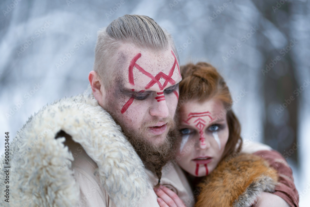Viking warrior hugging his red-haired female warrior Viking warrior hugging his red-haired female warrior