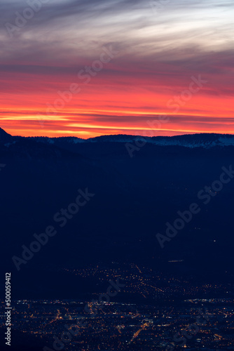 Sunset over the city and mountains
