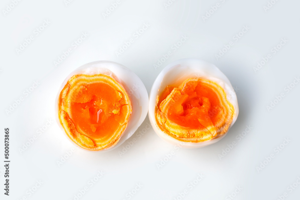 Boiled eggs cut in half isolated on white background