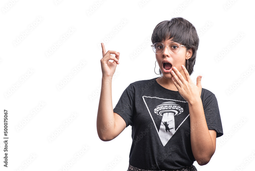 Horizontal of Latin woman on white background pointing upwards and with an expression of amazement. 