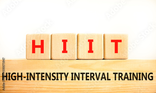 HIIT high-intensity interval training symbol. Concept words HIIT high-intensity interval training on blocks on a beautiful white background. HIIT high-intensity interval training concept. Copy space. photo