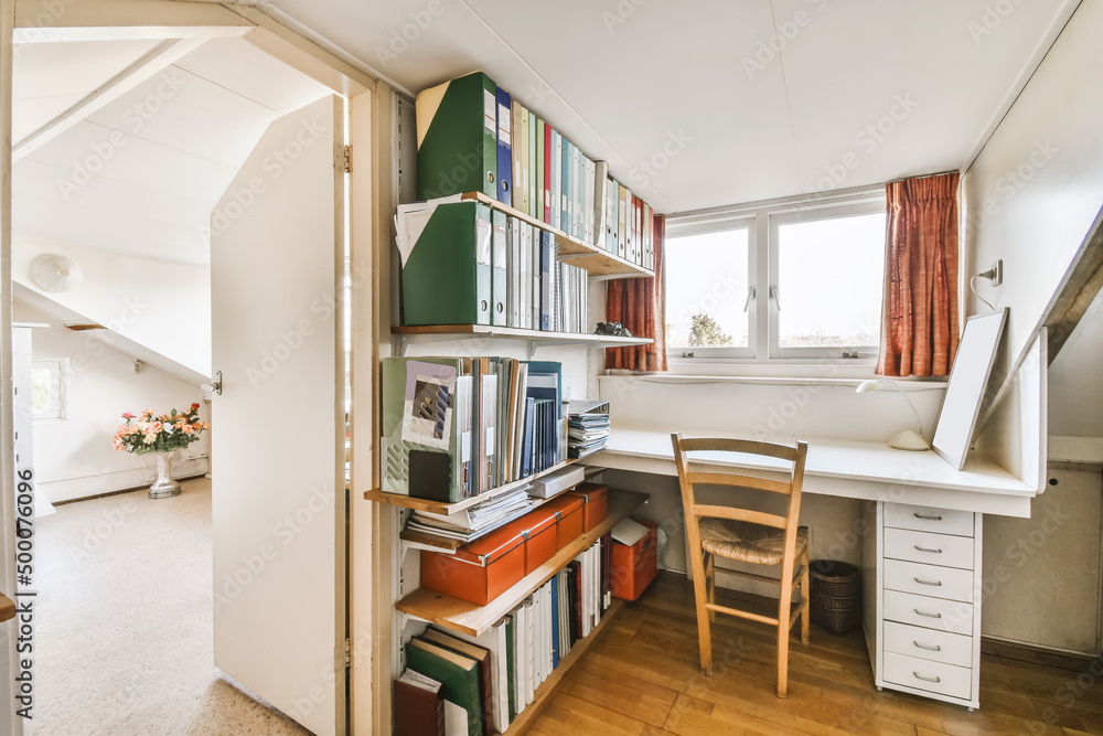 Room with various documents on shelves