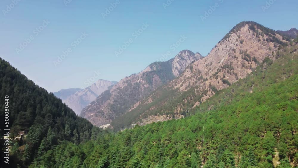 Aerial view of unpolluted green Himalaya forest with mountains peak in Parvati valley Aerial view of unpolluted green Himalaya forest with mountains peak in Parvati valley