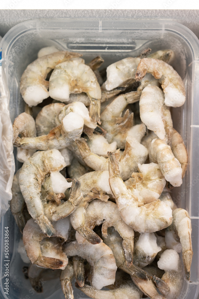 Frozen shrimp in fridge at the fish market. Healthy eating and fish market concept Frozen shrimp in fridge at the fish market. Healthy eating and fish market concept