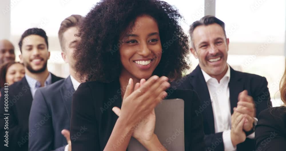 Im very impressed. Businesspeople applauding while attending a conference. Smiling group of diverse businesspeople applauding during conference.