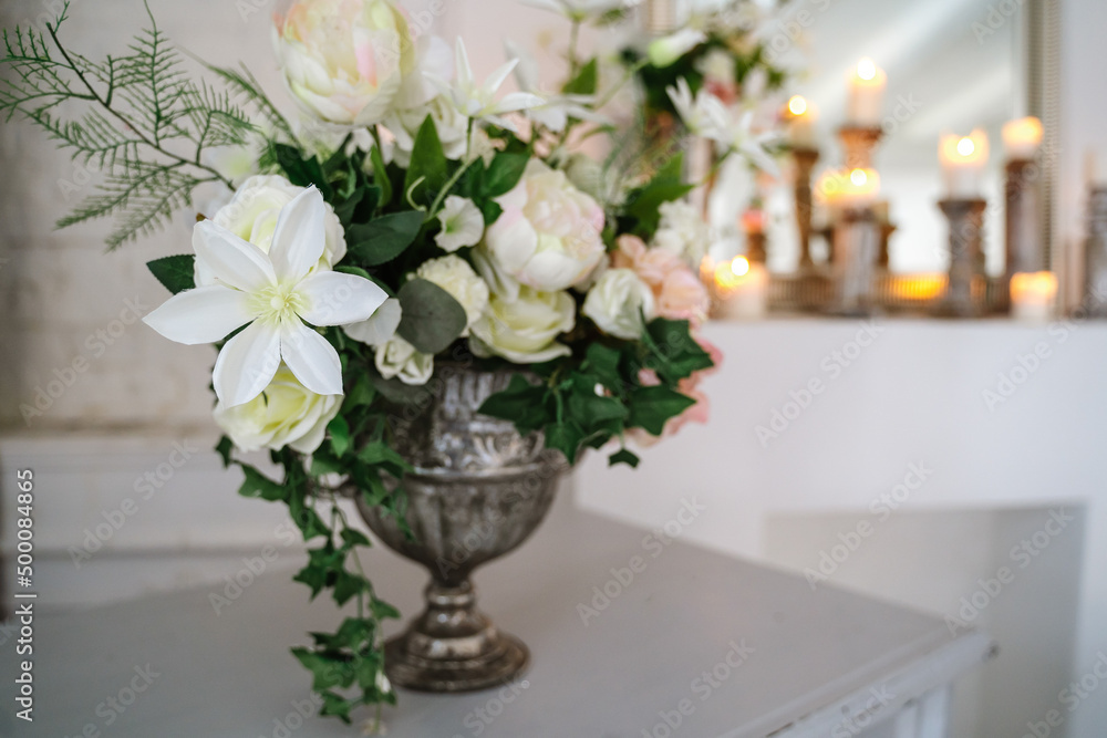 Fototapeta premium Arch decorated with artificial flowers. High quality photo