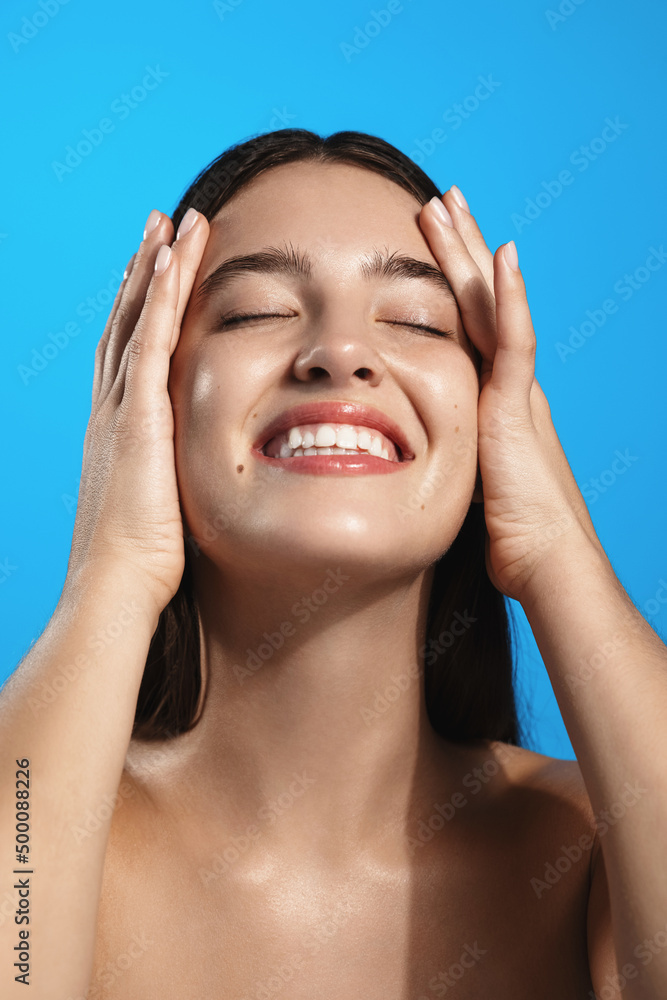 Vertical shot of beautiful girl washing in shower