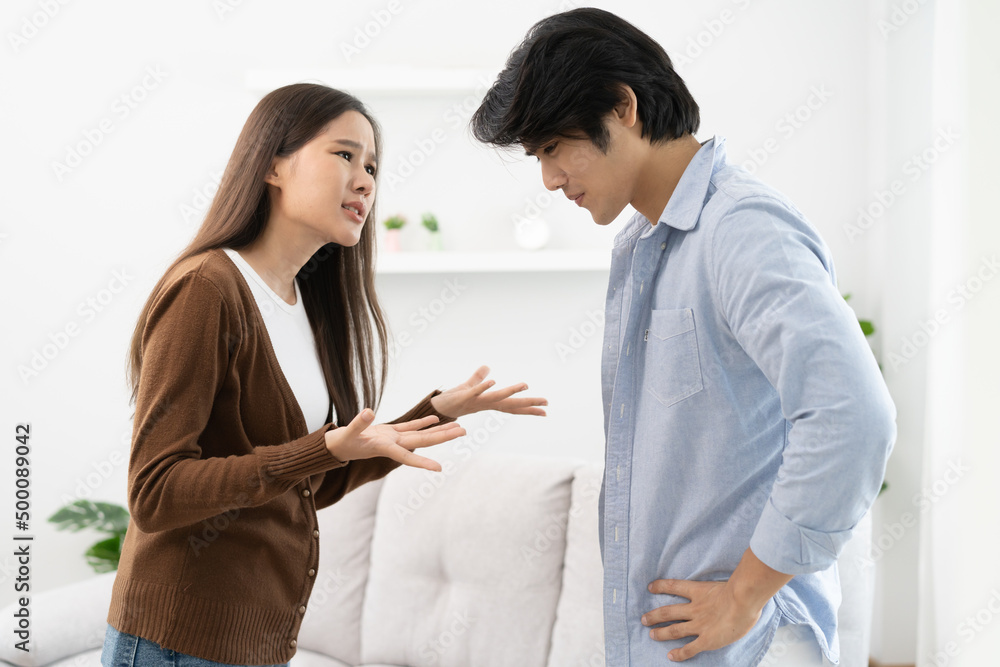 Family problems, Asian couple quarrel together at home. woman angry on man and man feel annoy. Family problems, Asian couple quarrel together at home. woman angry on man and man feel annoy.