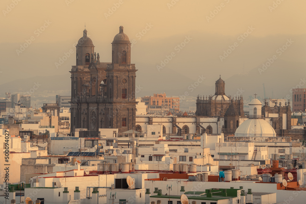 Las Palmas de Gran Canaria from the old part of the city at sunrise ​​with haze in the sky. Gran Canaria. Canary Islands