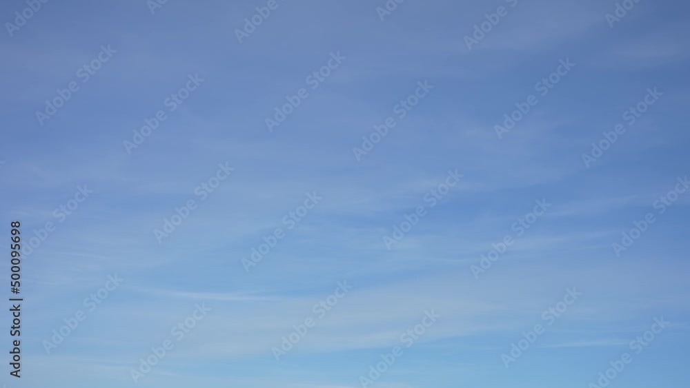 Beautiful sunny clear blue sky background. 4k video time lapse of sunny bright clean blue sky and soft transparent peaceful white clouds flying isolated on blue background. Abstract natural backdrop Beautiful sunny clear blue sky background. 4k video time lapse of sunny bright clean blue sky and soft transparent peaceful white clouds flying isolated on blue background. Abstract natural backdrop