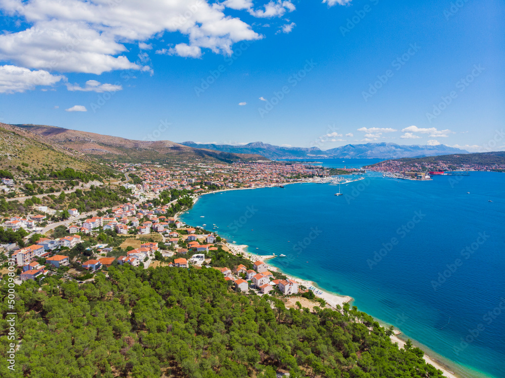 Croatia. Summer. Tourist season. Sunny day. Coast of the Adriatic Sea. Small town by the sea. Drone. Aerial view