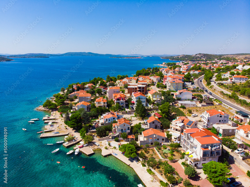Croatia. Summer. Sunny day. Coast of the Adriatic Sea. Small town by the sea. Holiday season. Popular tourist spot. Drone. Aerial view