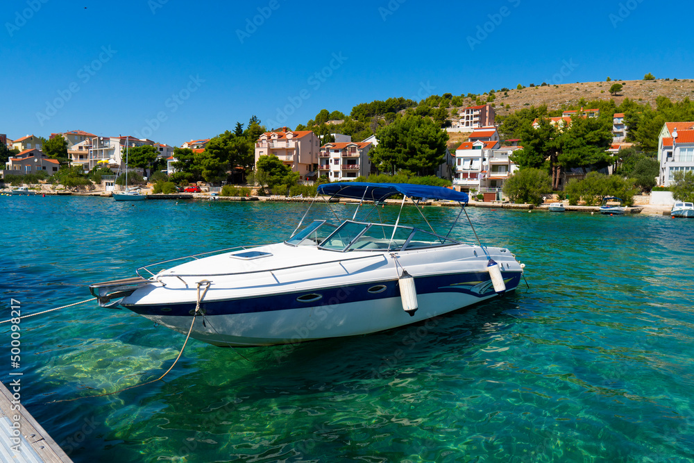 Obraz premium Croatia. Summer. Sunny day. Coast of the Adriatic Sea. Yacht parking near a small town by the sea. Holiday season. Popular tourist spot