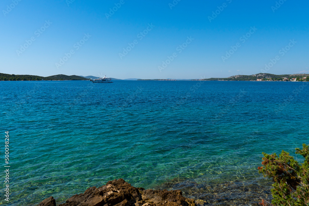 Croatia. Summer. Sunny day. Rocky shore of the Adriatic Sea. Tourist season. Popular holiday destination Croatia. Summer. Sunny day. Rocky shore of the Adriatic Sea. Tourist season. Popular holiday destination