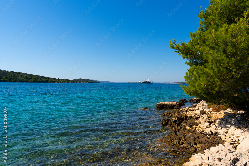 Croatia. Summer. Sunny day. Rocky shore of the Adriatic Sea. Tourist season. Popular holiday destination Croatia. Summer. Sunny day. Rocky shore of the Adriatic Sea. Tourist season. Popular holiday destination