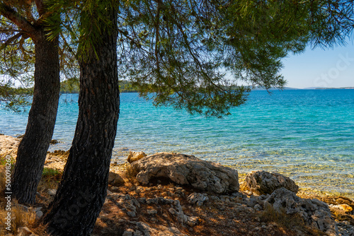 Croatia. Summer. Sunny day. Rocky shore of the Adriatic Sea. Tourist season. Popular holiday destination