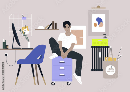 A young male Asian character sitting on a file cabinet with drawers, a dorm or home office interior