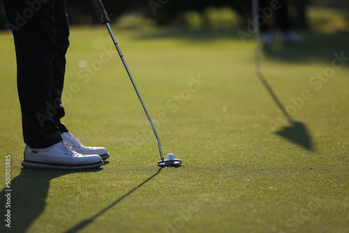 Young male golfer player on golf course