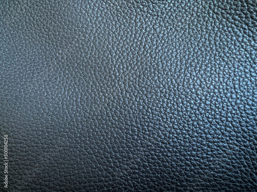 Leather or leatherette. Old grey artificial leather. Close-up. Background. Texture. Pattern. photo
