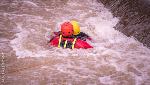 Rescue swimmers are practicing on dangerous weir 
