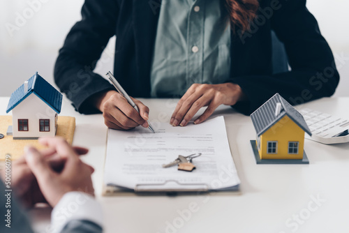 Image of business woman or agency notary public hand pointing at the contract. business man, law attorney, lawyer notary public, bank manager concept.