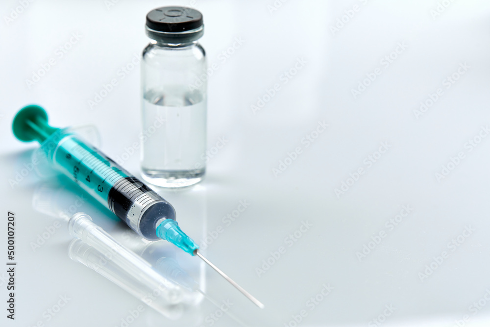 Vaccine in vial with syringe Vaccine in vial with syringe