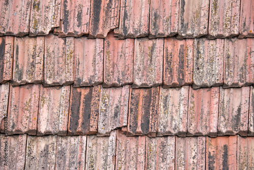 Closeup surface of old weathered ceramic tiles covering building roof