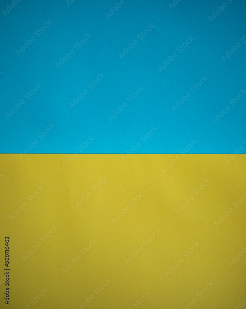 Abstract blue yellow background. Colors of the flag of Ukraine. Textured paper