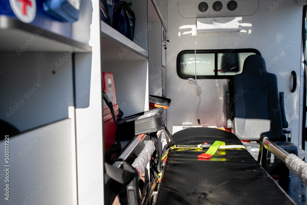Interior of an ambulance car: stretcher, bags, other medical equipment Interior of an ambulance car: stretcher, bags, other medical equipment