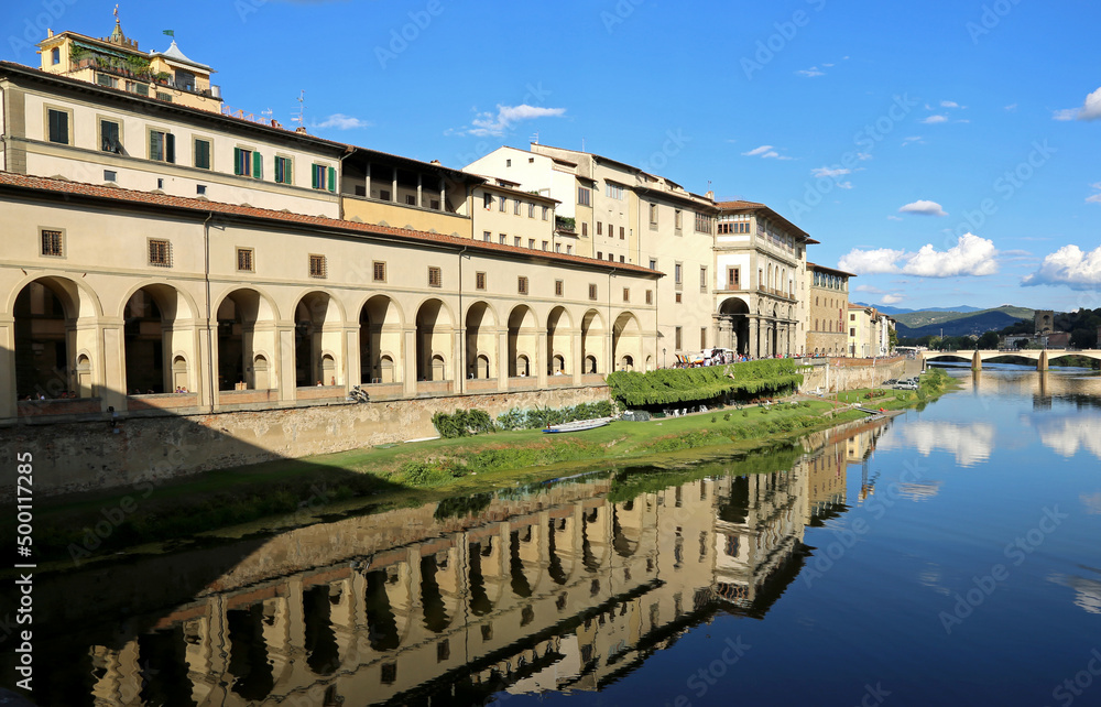 arcade with the reflection on the river Arno called CORRIDOIO VASARIANO in the city of Florence in the region of Tuscany in ITALY
