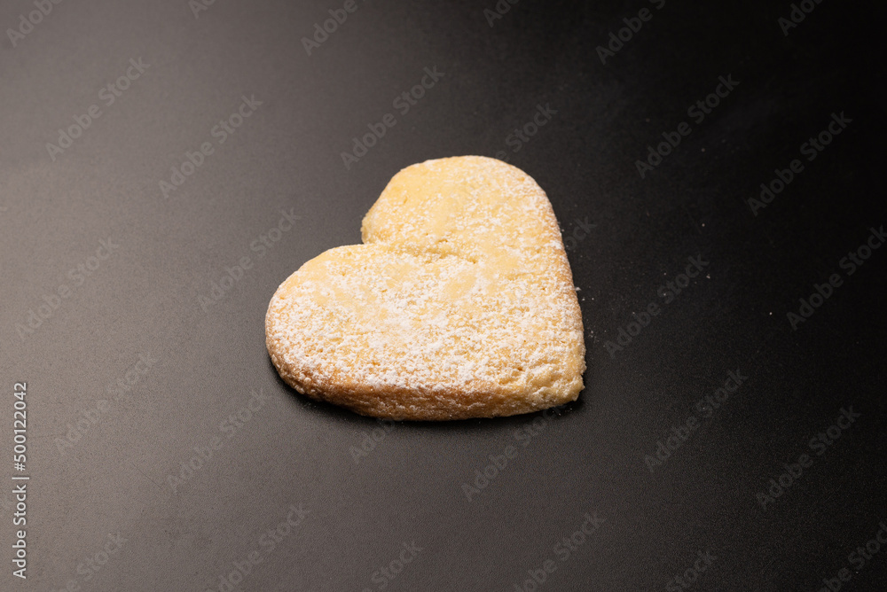 Shortbread in the shape of a heart isolated on white background. Shortbread in the shape of a heart isolated on white background.