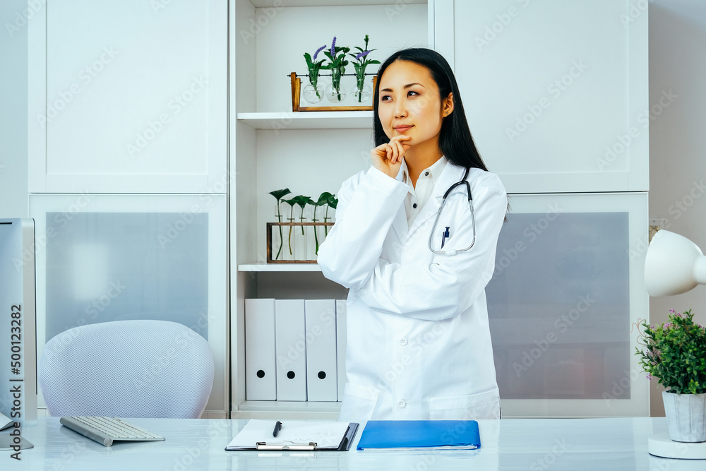 portrait of a young thoughtful female doctor in a hospital. healthcare industry portrait of a young thoughtful female doctor in a hospital. healthcare industry