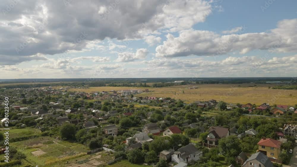 Aerial view of a city in Ukraine, many half-timbered houses. Thick clouds and a sunny day at sunset in an eco-friendly town. Aerial view of a city in Ukraine, many half-timbered houses. Thick clouds and a sunny day at sunset in an eco-friendly town.