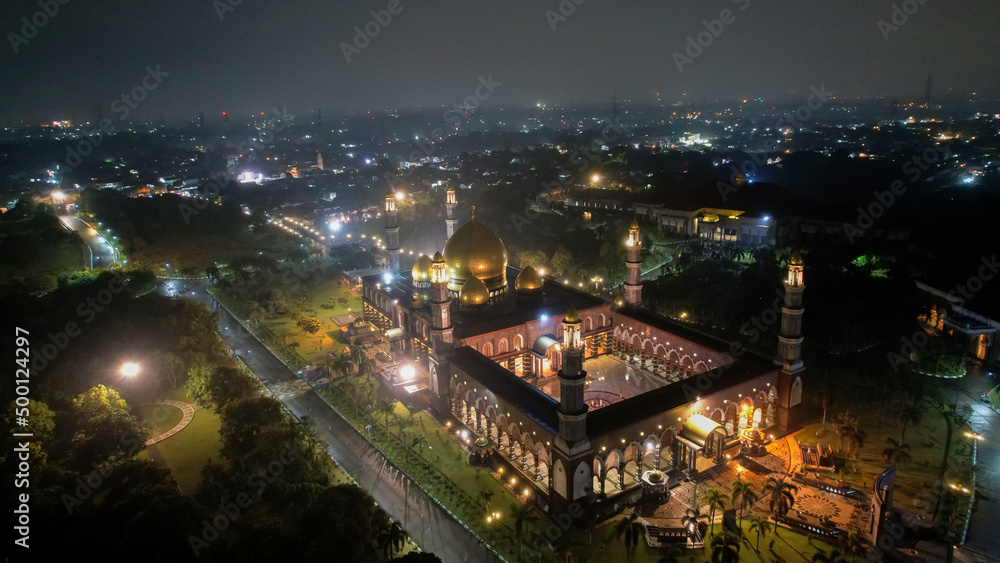 The Largest Mosque Masjid Kubah Emas at Depok at night, Ramadan Eid Concept background, Travel and tourism. Depok, Indonesia April 21 2022