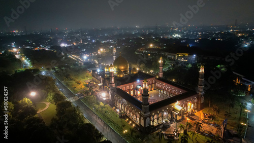 The Largest Mosque Masjid Kubah Emas at Depok at night, Ramadan Eid Concept background, Travel and tourism. Depok, Indonesia April 21 2022 © syahrir