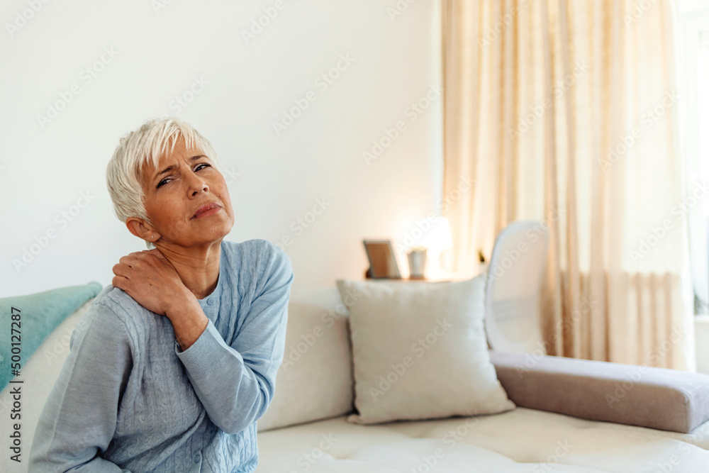 Mature woman with shoulder pain. Elderly woman is enduring awful ache. Shoulder pain in an elderly person. Beautiful lady with shoulder pain. Photo of senior woman holding her neck in pain. Mature woman with shoulder pain. Elderly woman is enduring awful ache. Shoulder pain in an elderly person. Beautiful lady with shoulder pain. Photo of senior woman holding her neck in pain.