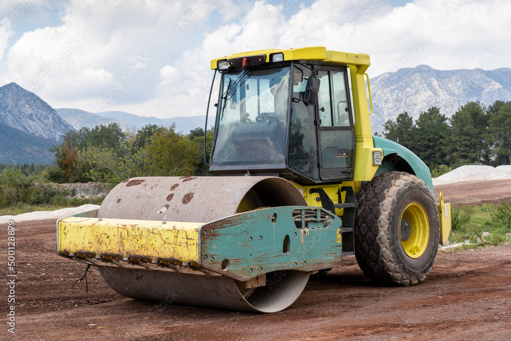 Road compactor. Heavy duty vibratory road roller for soil and road repairs.    