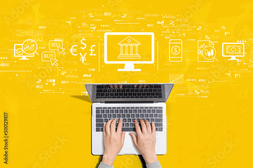 Fintech theme with person using a laptop computer photo