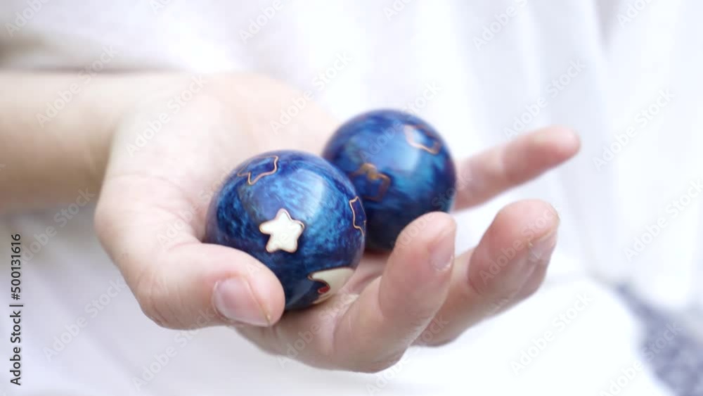 woman with chinese balls used for meditation woman with chinese balls used for meditation