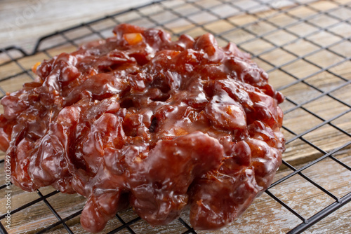 A view of an apple fritter donut.