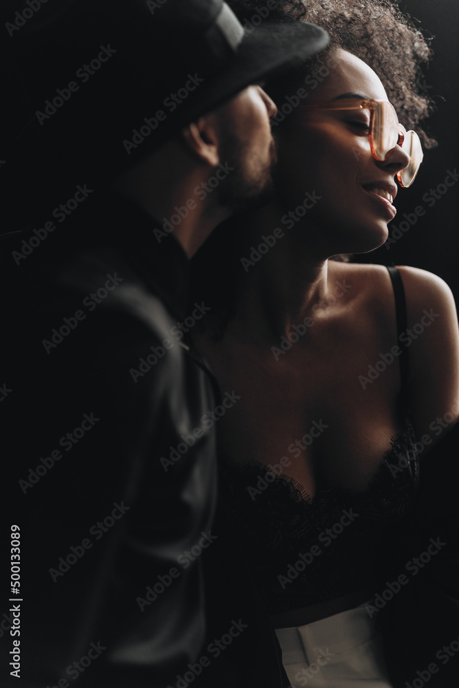 Beautiful multiethnic couple hugging.  African american woman with curly hair and european man