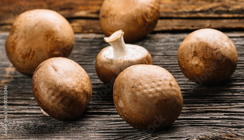 Mushrooms and potato on a old wooden table, selective focus, space for text, stock photo