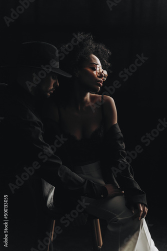 Beautiful multiethnic couple hugging.  African american woman with curly hair and european man © ALEXSTUDIO