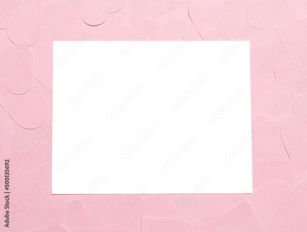 White sheet on pink paper hearts