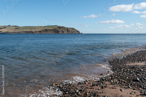 Cromarty Beach and view of Nigg, Cromarty Firth and the North Sea on the Black Isle in Scotland. Ocean scape. Sunny day. photo