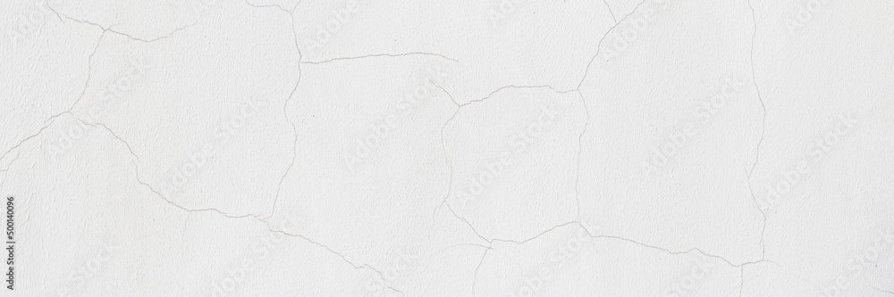 Obraz premium Old wall with cracked plaster. Weathered rough surface. Wide panoramic texture for background and design.