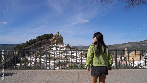 Couple walking towards famous viewpoint in Montefrio, Andalusia, Spain photo