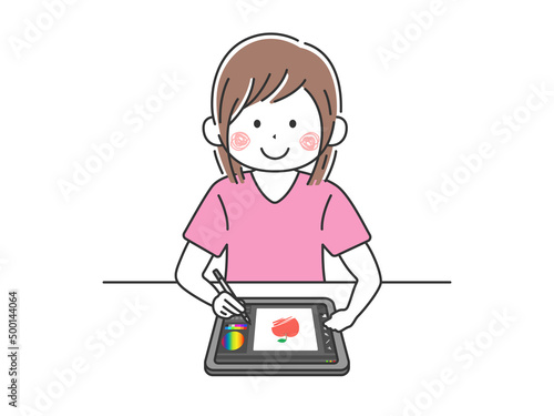 ペンタブレットを使って、イラストをかく女性