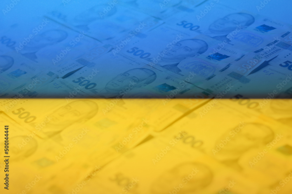 Naklejka premium Defocus ukrainian money backdrop. Background of the five hundred hryvnia banknotes. Close-up view. Ukraine economic. Paper money. Ukraine flag. Out of focus