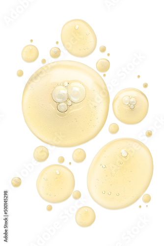 Quadro su tela Drops of cosmetic serum on white background